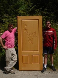 Hummingbird+carved+into+old-growth+fir+doors.+Paul+and+Mastercarver+Byron+Fader+(1-604-413+1726)